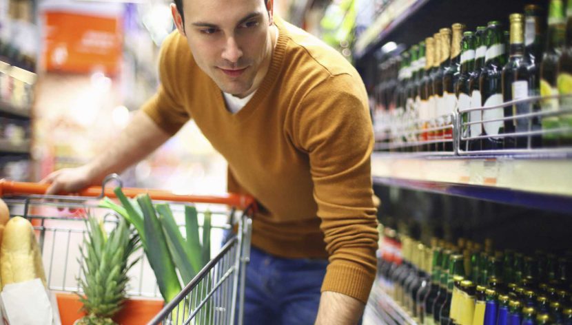 shopper finds stocked wine and spirits shelves